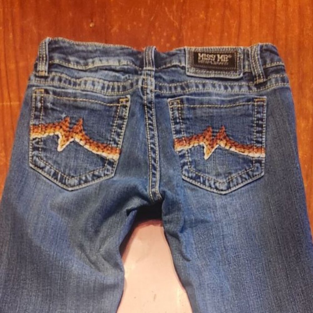 Miss Me embroidered pocket jeans.